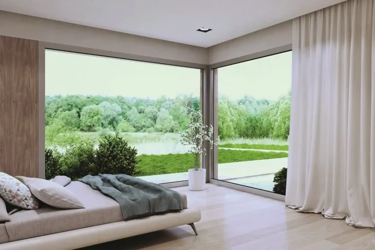 Okna fix - Aluminiowe okna stałe w sypialni. Widok na ogród